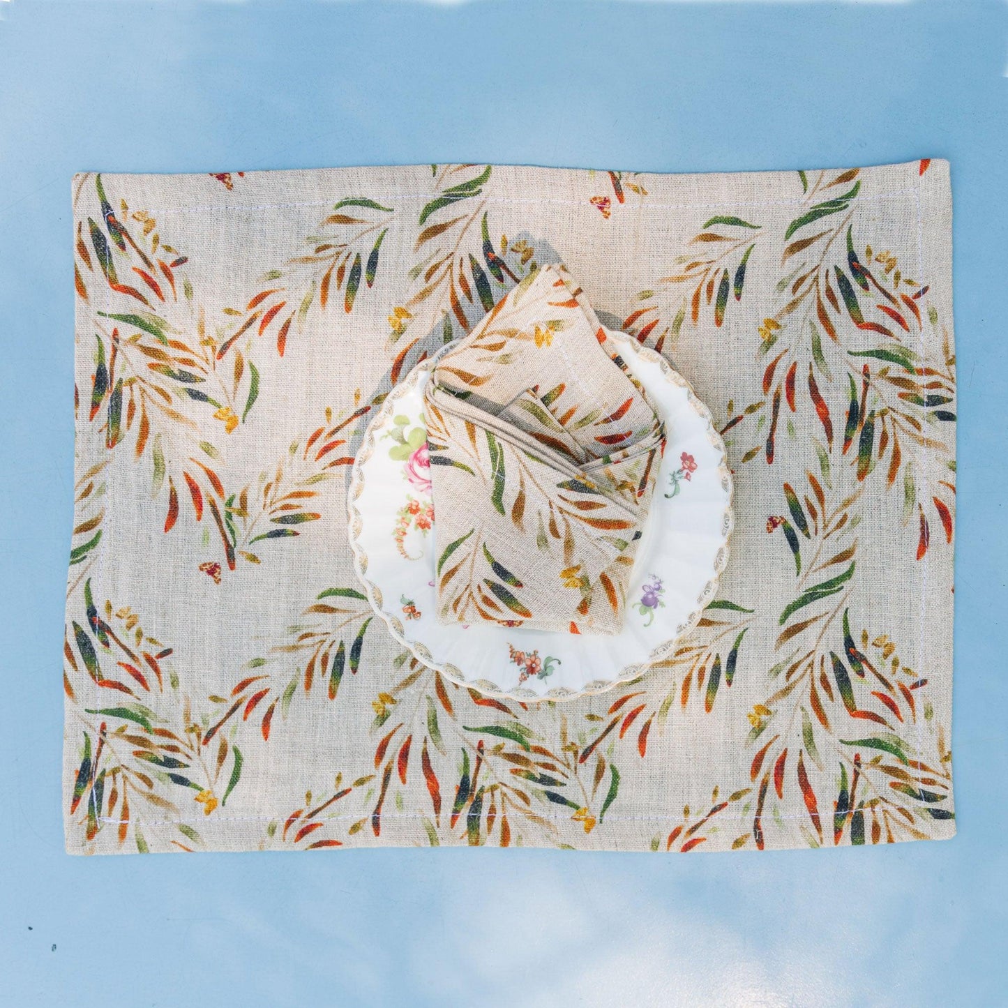 Table setting of organic linen napkin and placemat printed with low impact dyes, designed by Sophie Williamson Design.