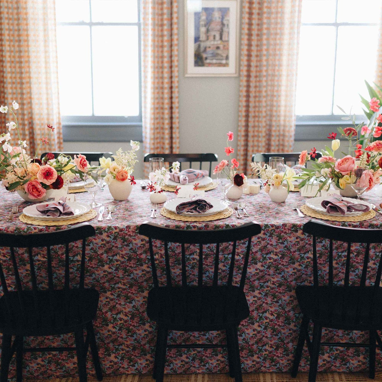 bright floral table sets on a marble counter top, with fresh salad bowls