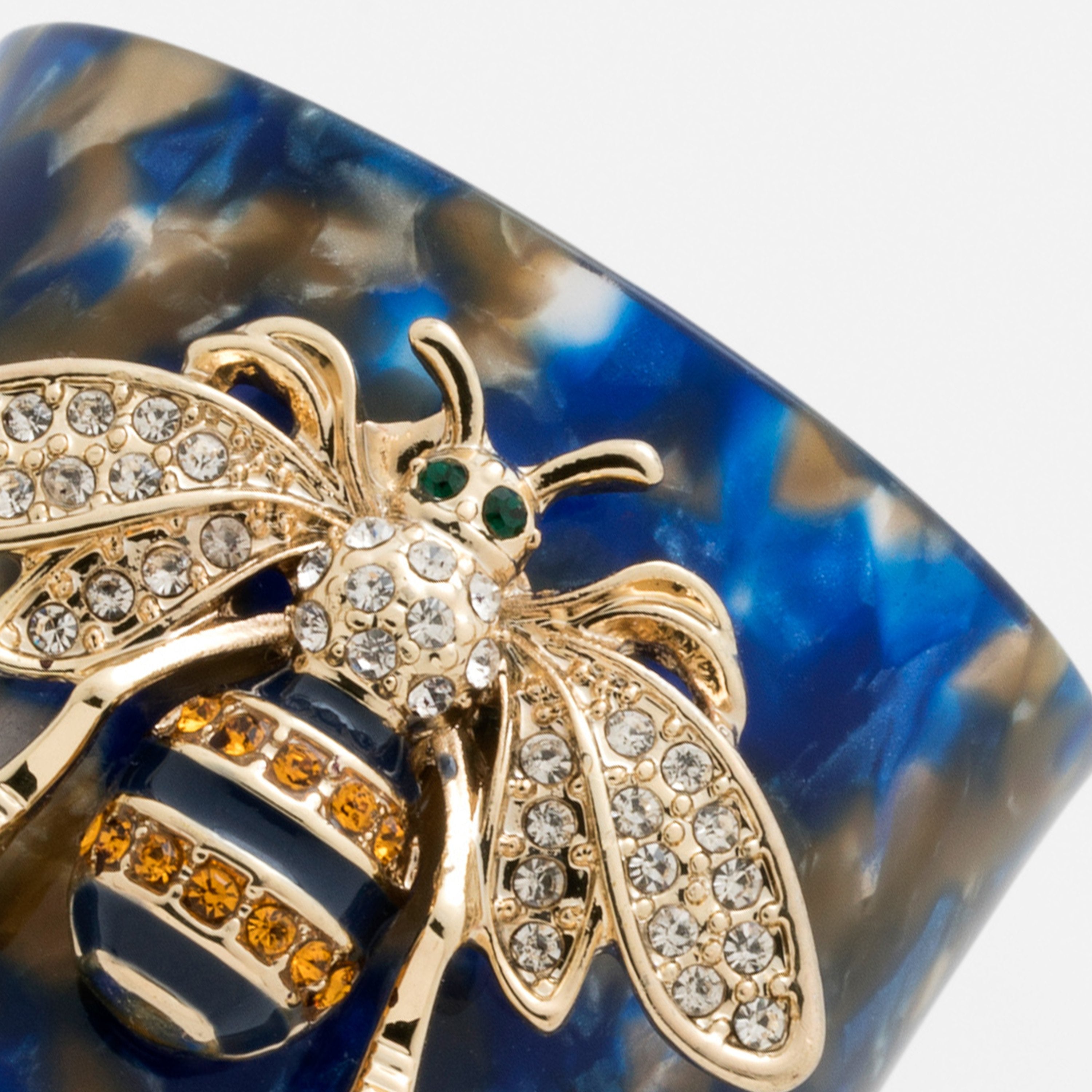 Stripey bee resin napkin rings, blue tortoiseshell, set of four
