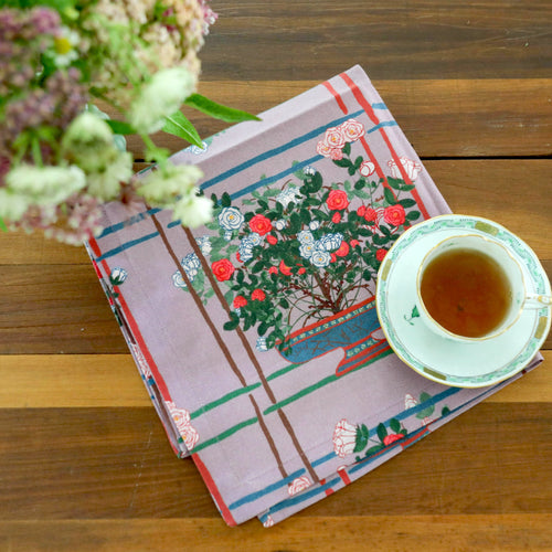 Set of decorative napkins with purple floral patterns 