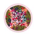 Round placemat with green and pink floral geometric print in organic cotton.