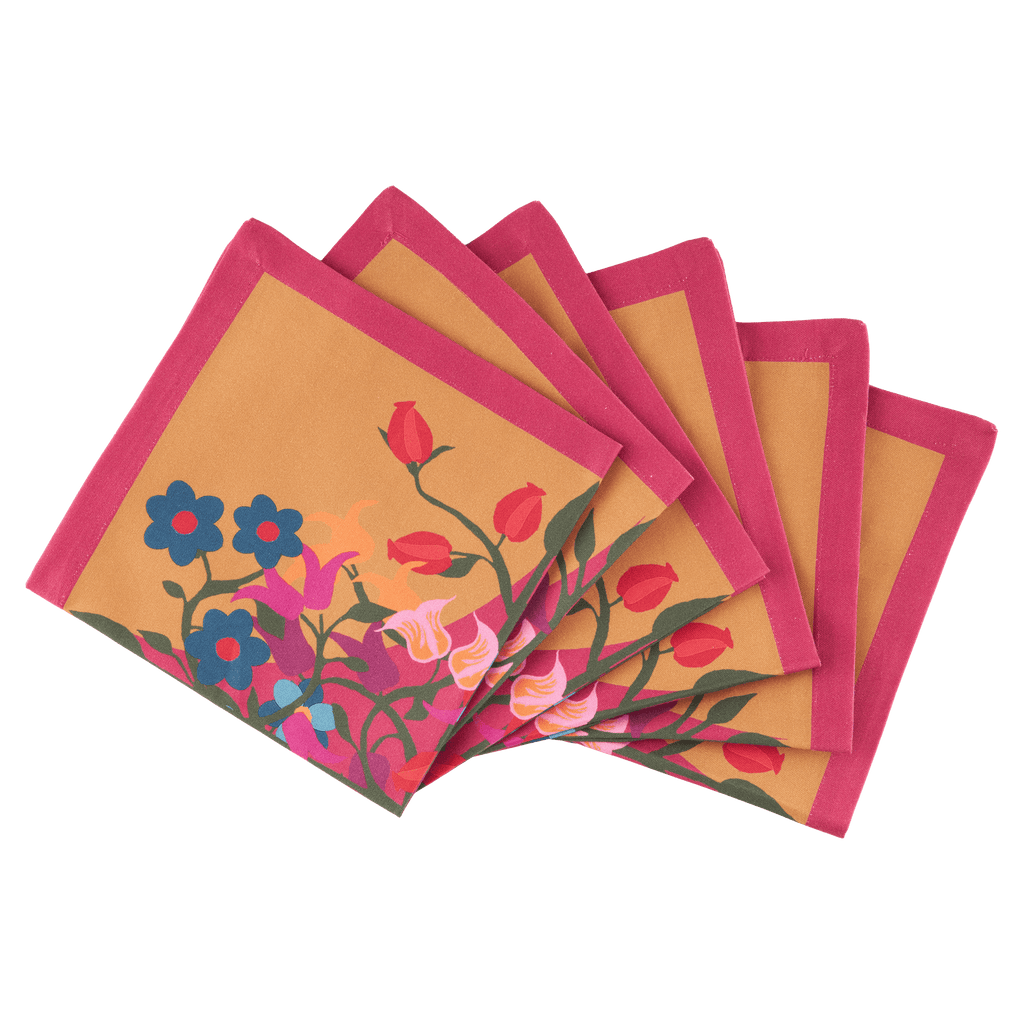 Organic Cotton Napkins printed with floral and geometric motifs in orange and pink, designed by Sophie Williamson Design
