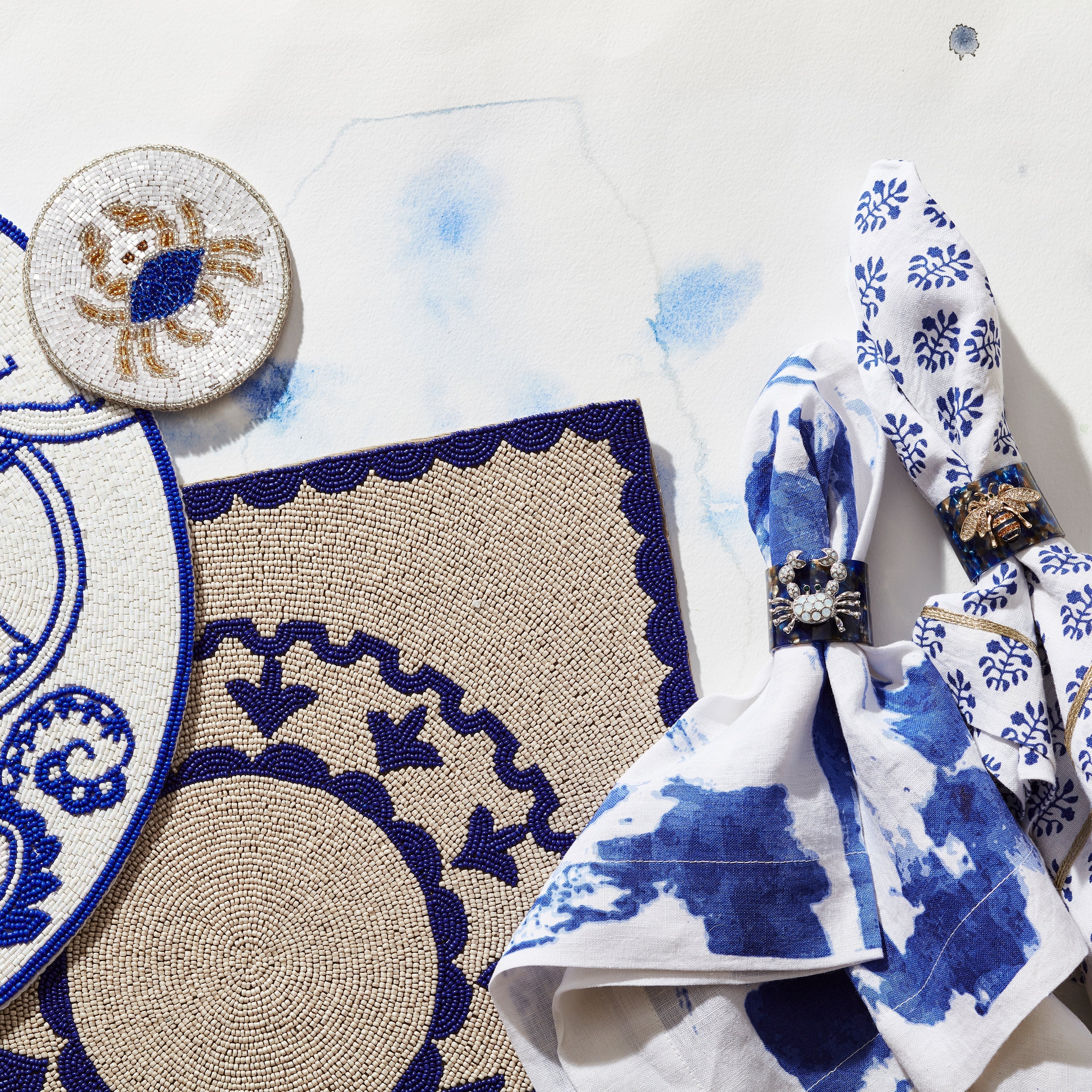 Stripey bee resin napkin rings, blue tortoiseshell, set of four