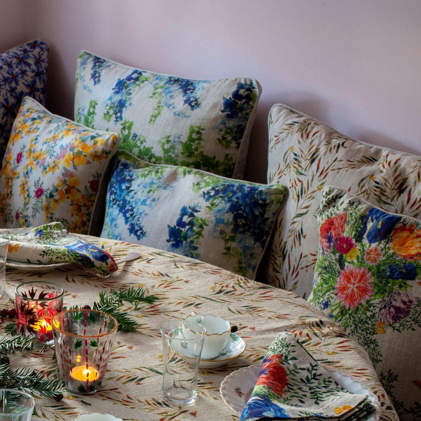 Colorful floral print linen pillow covers on kitchen banquette.