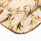 Corner detail of a ruffled pillow made of organic linen.