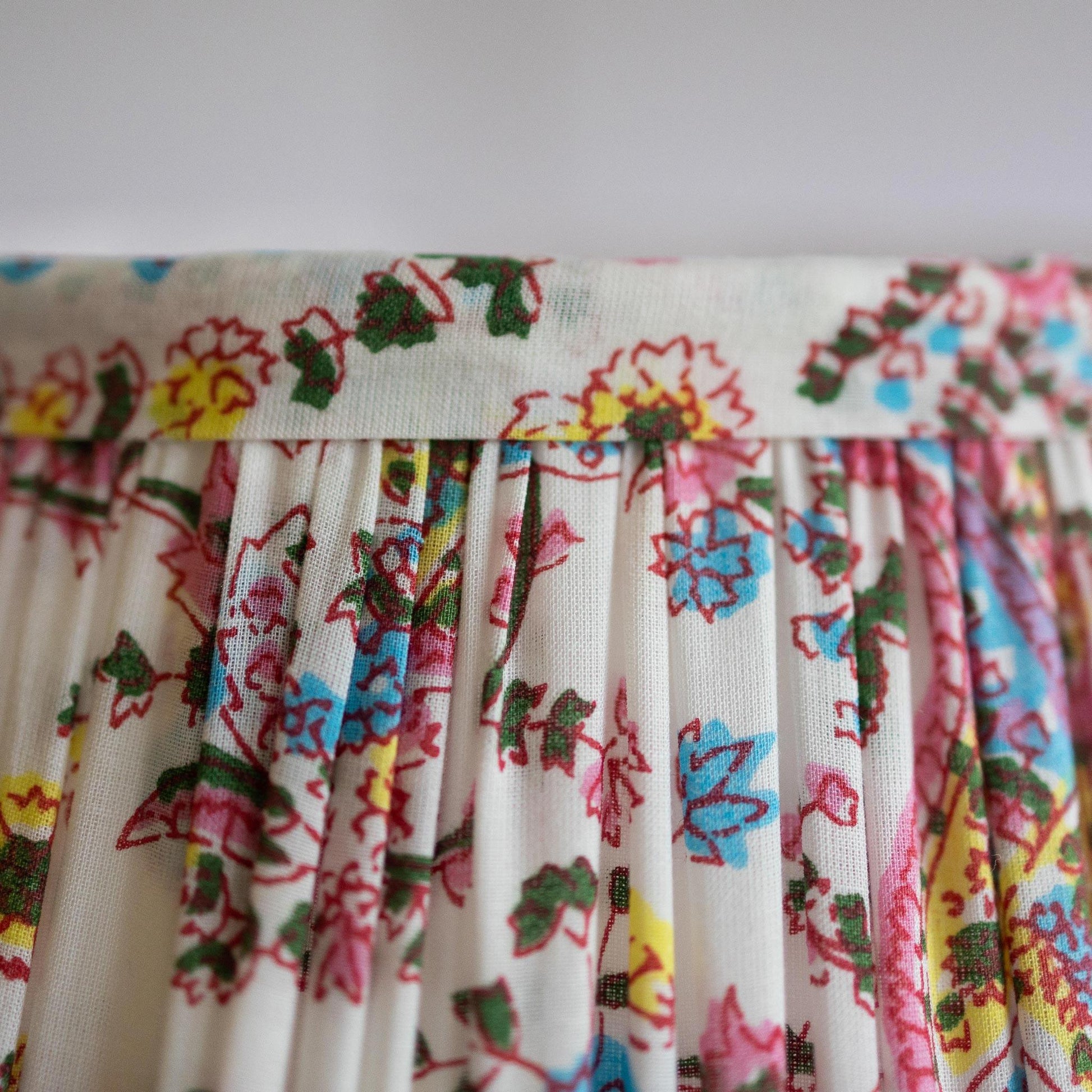 Border Detail of organic cotton pleated lampshade hand block printed in paisley pink.